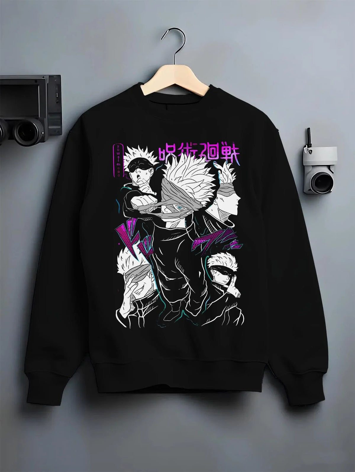 Black crewneck sweatshirt on hanger featuring Gojo Satoru blindfold cursed power artwork.