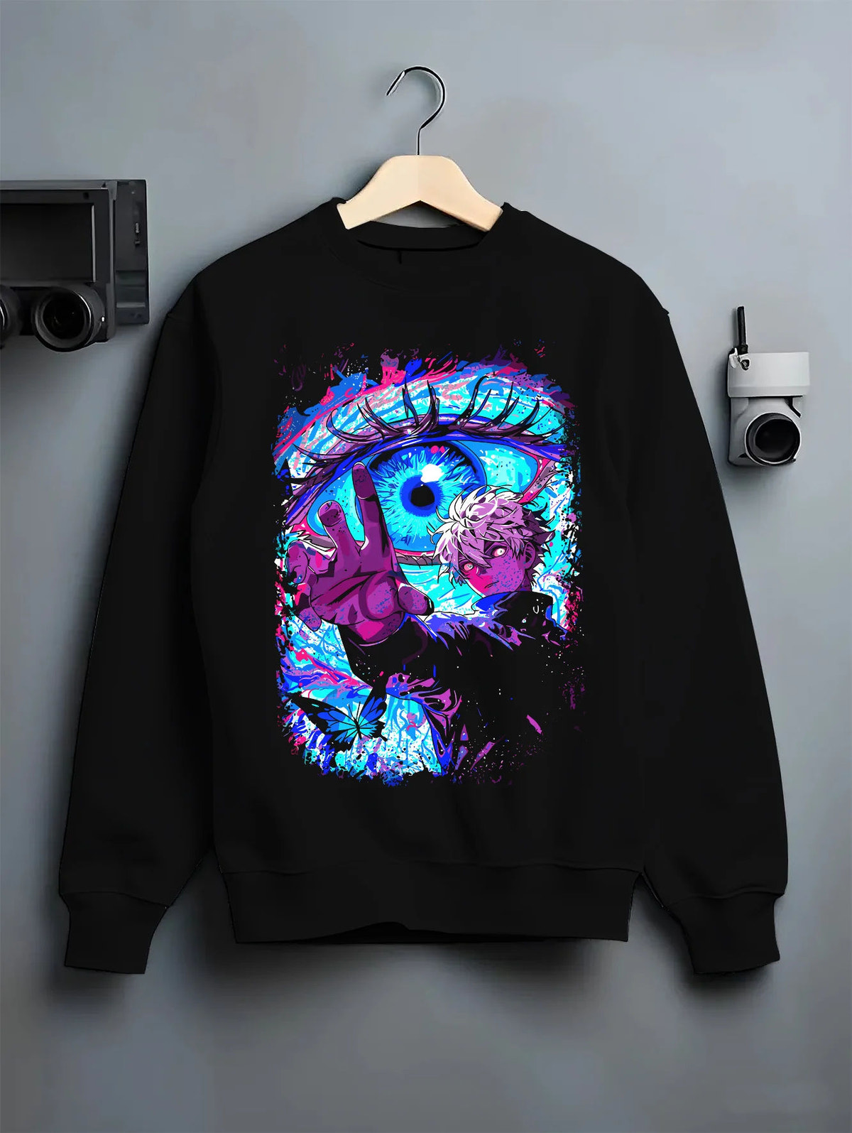 Black crewneck sweatshirt on hanger showing Satoru Gojo from Jujutsu Kaisen: Six Eyes and cursed energy
