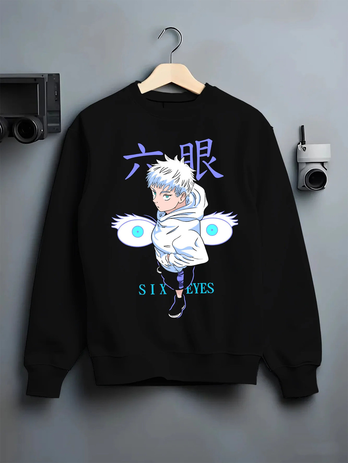 Black crewneck sweatshirt on hanger showing Satoru Gojo from Jujutsu Kaisen: chibi Six Eyes illustration