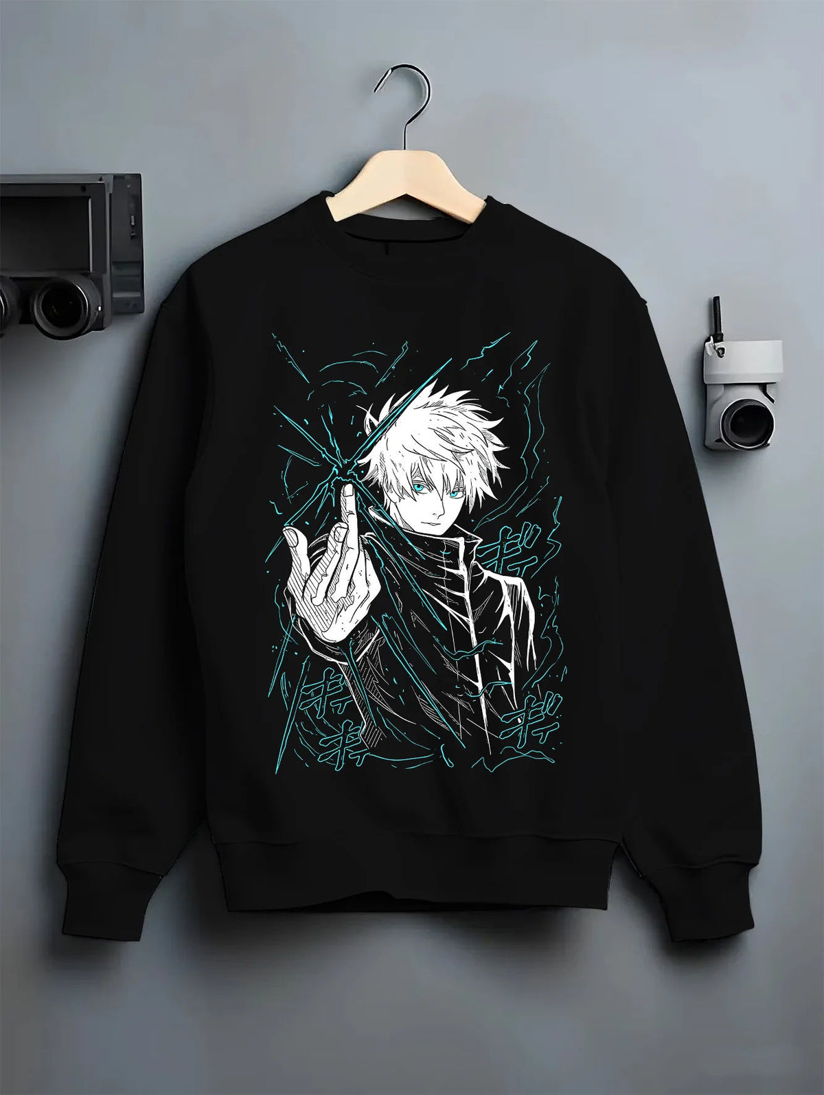 Black crewneck sweatshirt on hanger showing Satoru Gojo from Jujutsu Kaisen: hand sign and blue aura