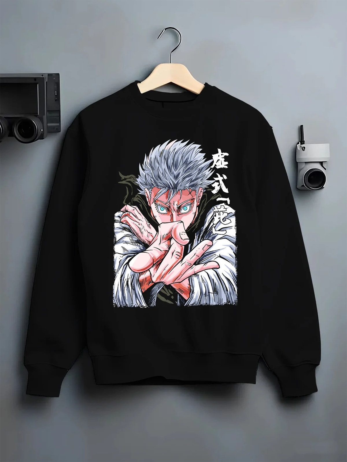 Black crewneck sweatshirt on hanger showing white-haired Jujutsu Kaisen fighter: hand-sign portrait