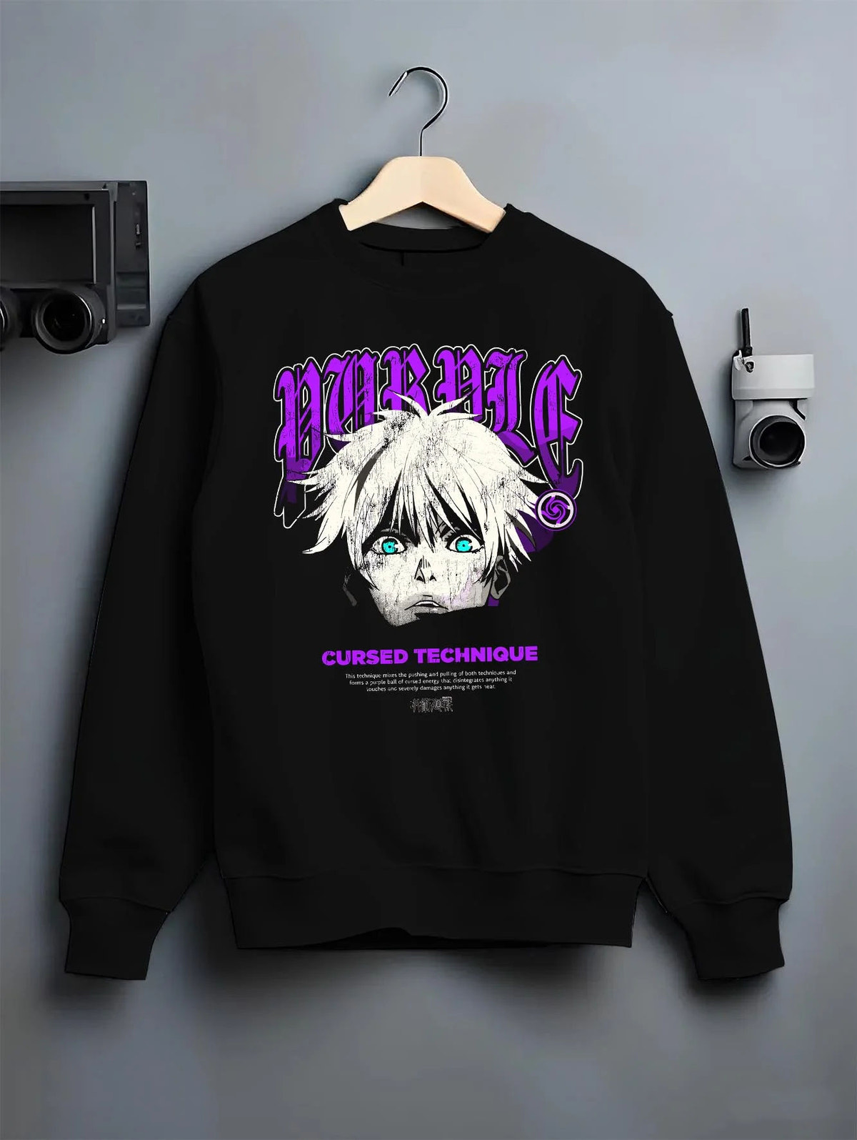 Black crewneck sweatshirt on hanger featuring Gojo Satoru cursed technique eyes artwork.