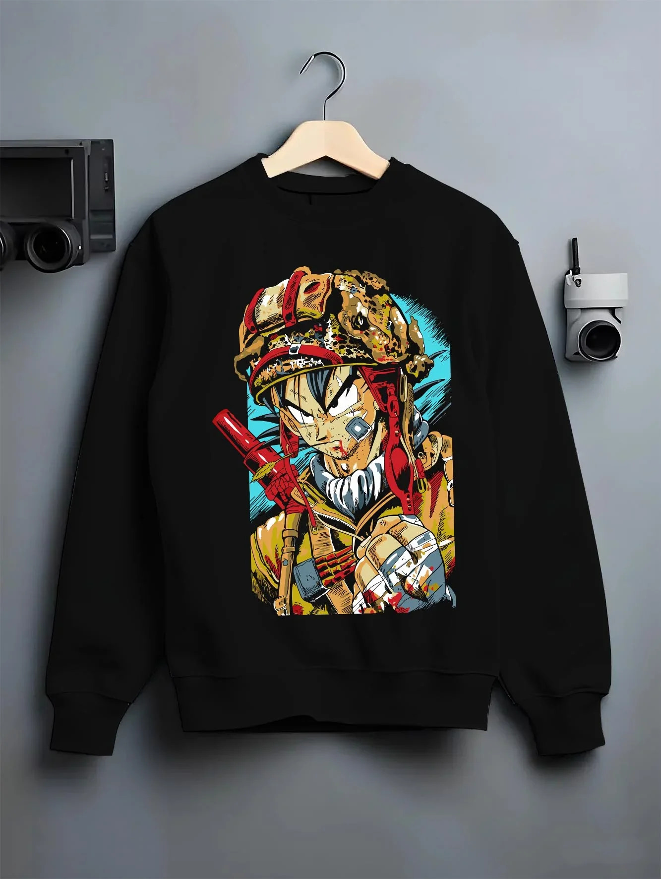 Black crewneck sweatshirt on hanger with Dragon Ball Z Hoodie Goku Army Battle Jumper graphic bold anime graphic.
