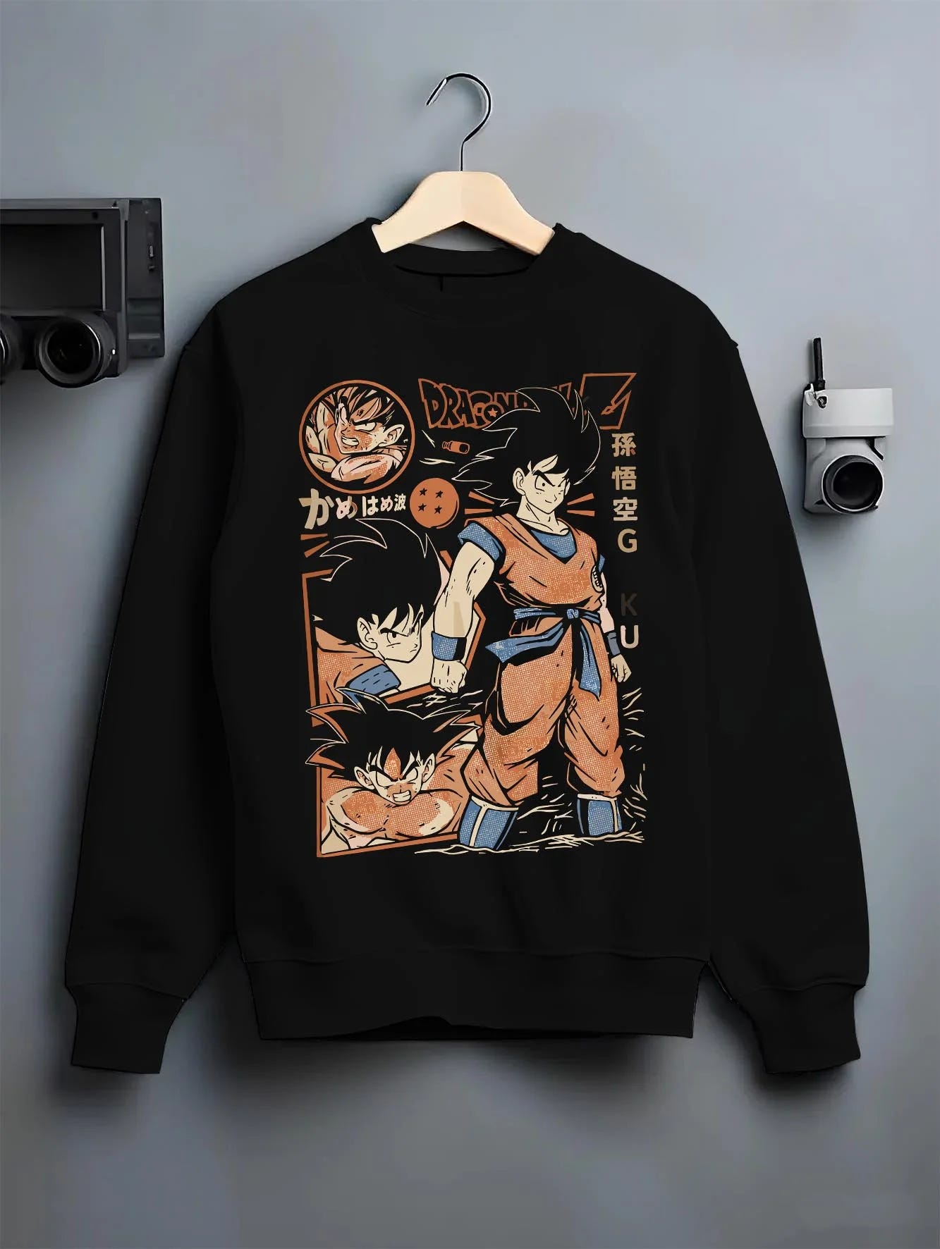 Black crewneck sweatshirt on hanger with Goku Hoodie Dragon Ball Z Bardock Family Legacy graphic streetwear graphic.