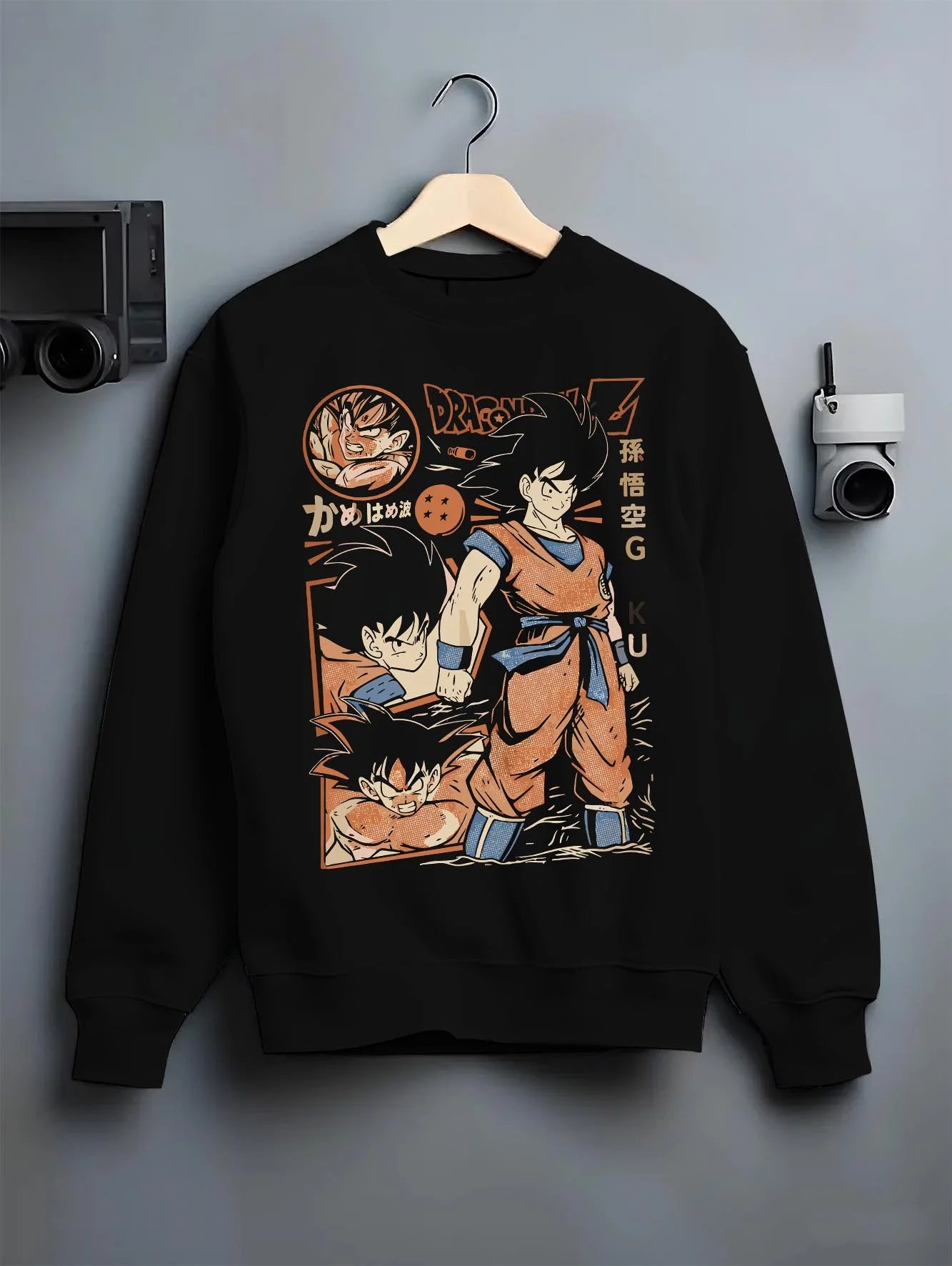 Black crewneck sweatshirt on hanger with Goku Hoodie Dragon Ball Z Bardock Family Legacy graphic streetwear graphic.