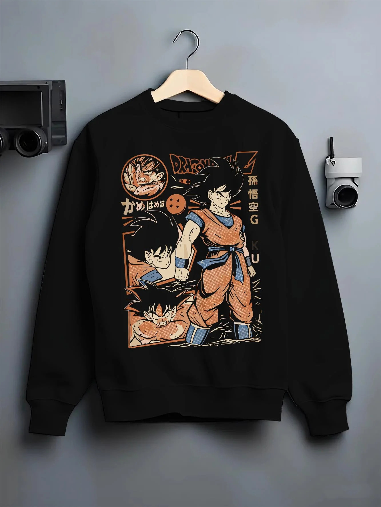 Black crewneck sweatshirt on hanger with Goku Hoodie Dragon Ball Z Bardock Family Legacy graphic streetwear graphic.