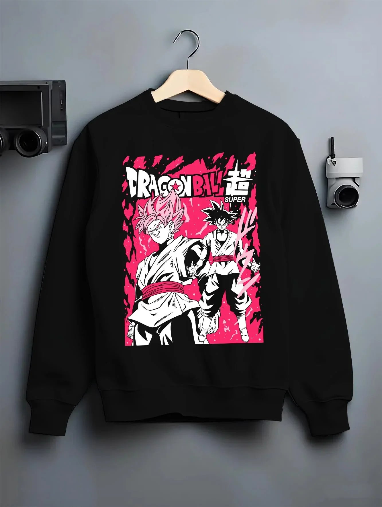 Black crewneck sweatshirt on hanger with Dragon Ball Z Hoodie Goku Black vs Zamasu Jumper graphic streetwear graphic.