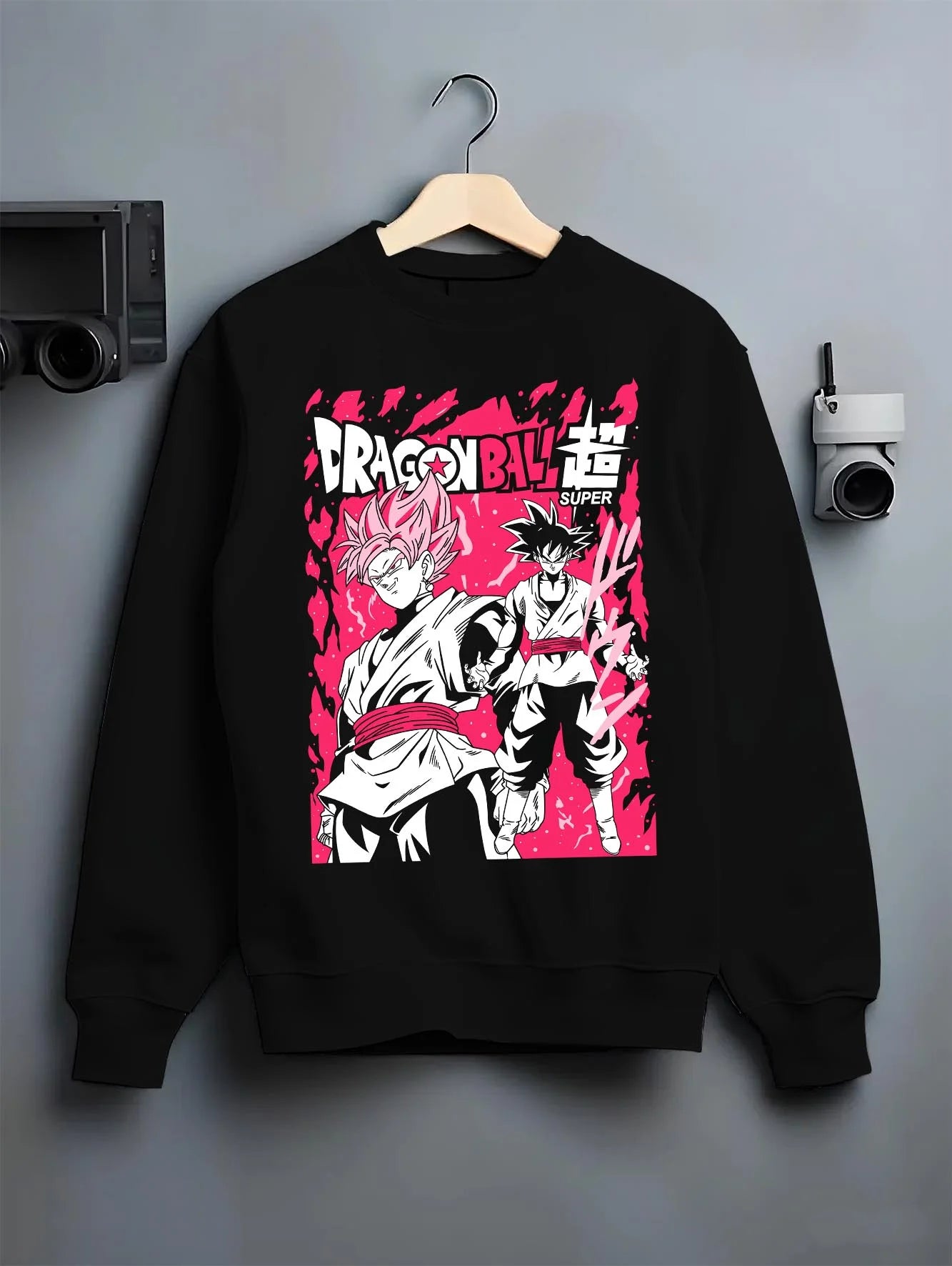Black crewneck sweatshirt on hanger with Dragon Ball Z Hoodie Goku Black vs Zamasu Jumper graphic streetwear graphic.