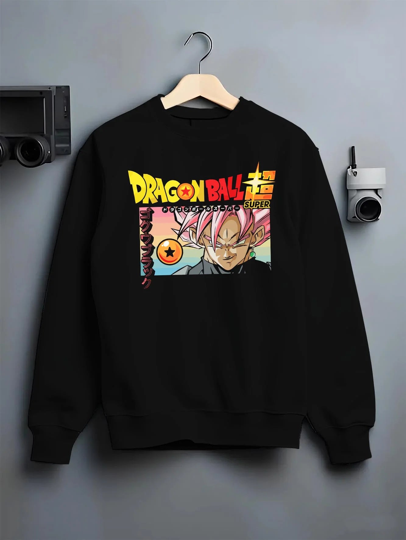 Black crewneck sweatshirt on hanger with Dragon Ball Z Hoodie Goku Black Form Power Jumper graphic premium wear.