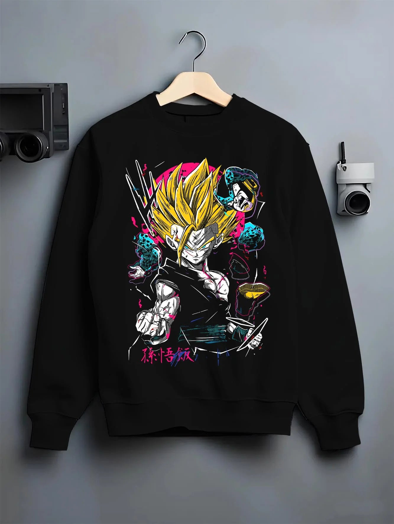 Black crewneck sweatshirt on hanger with Goku Hoodie Dragon Ball Z Super Saiyan Charge Up graphic Goku anime design.