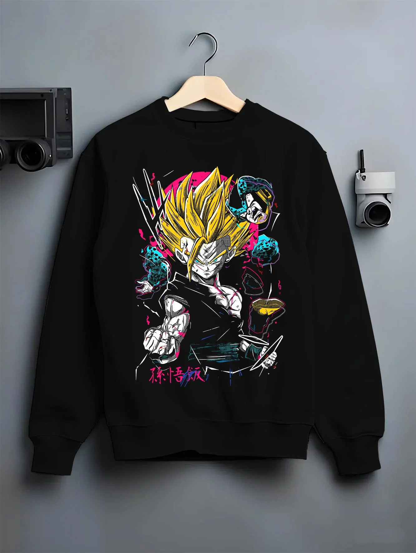 Black crewneck sweatshirt on hanger with Goku Hoodie Dragon Ball Z Super Saiyan Charge Up graphic Goku anime design.