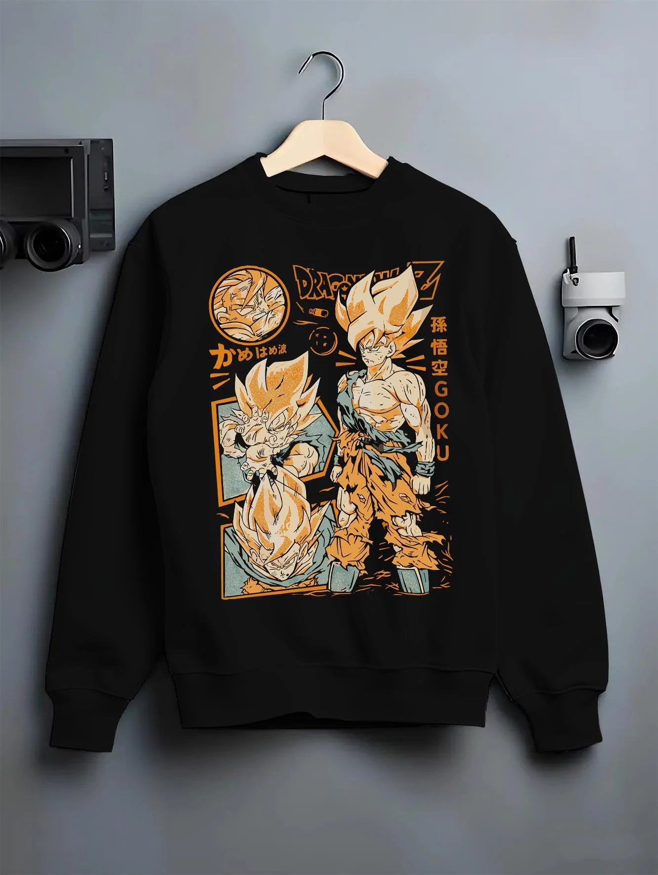 Black crewneck sweatshirt on hanger with Goku Hoodie Dragon Ball Z Super Saiyan Kamehameha graphic Goku themed artwork.