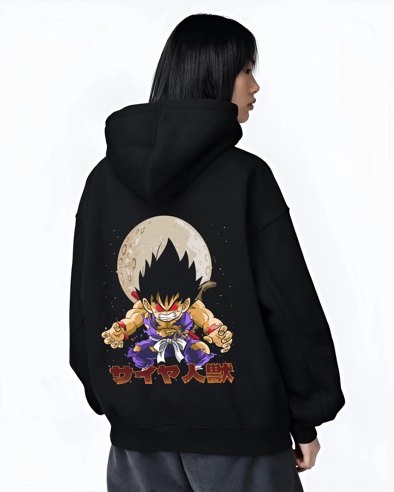 Black hoodie worn by female model, back view with Dragon Ball Z Hoodie Kid Goku Oozaru Transformation graphic bold anime graphic.