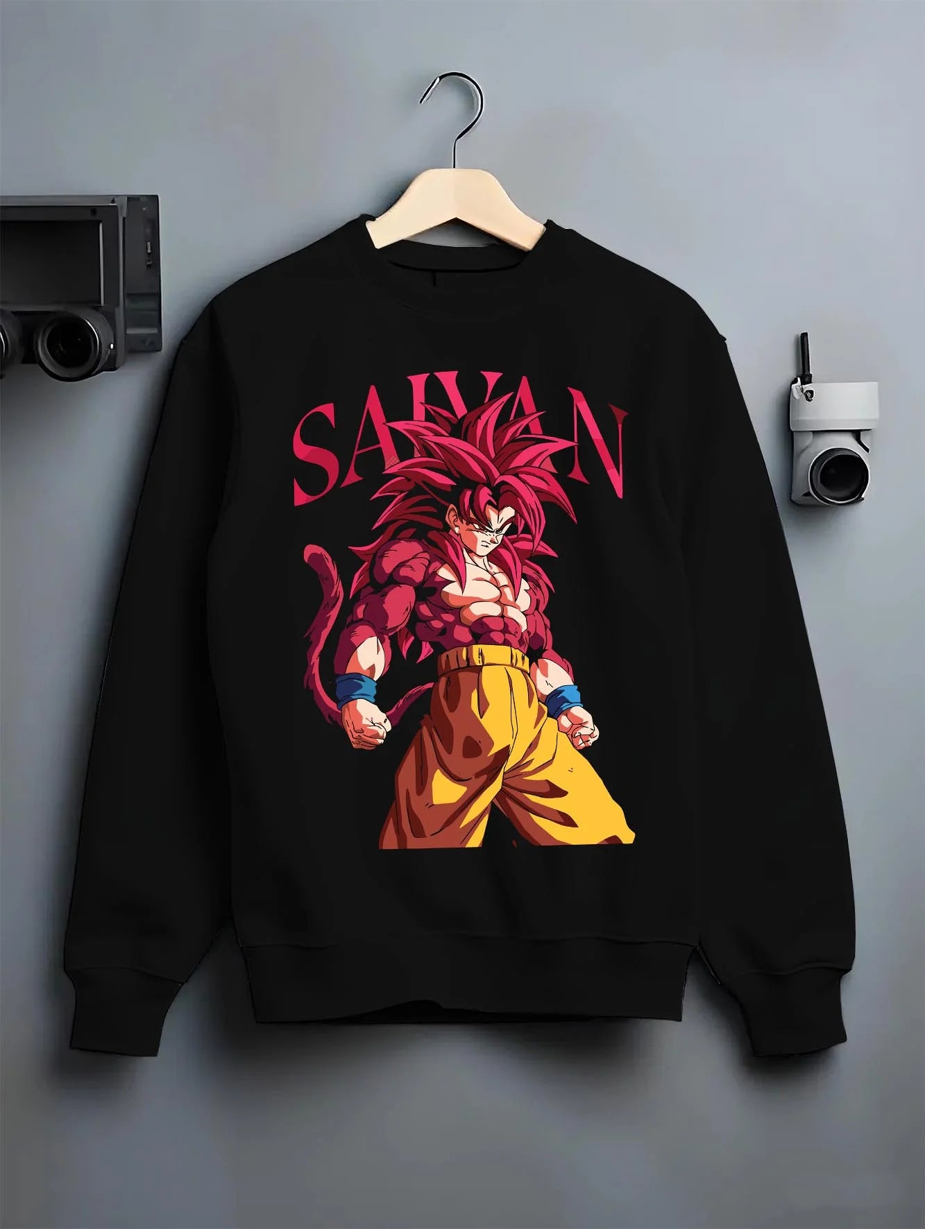 Black crewneck sweatshirt on hanger with Dragon Ball Z Hoodie Goku Super Saiyan 4 Jumper graphic premium wear.