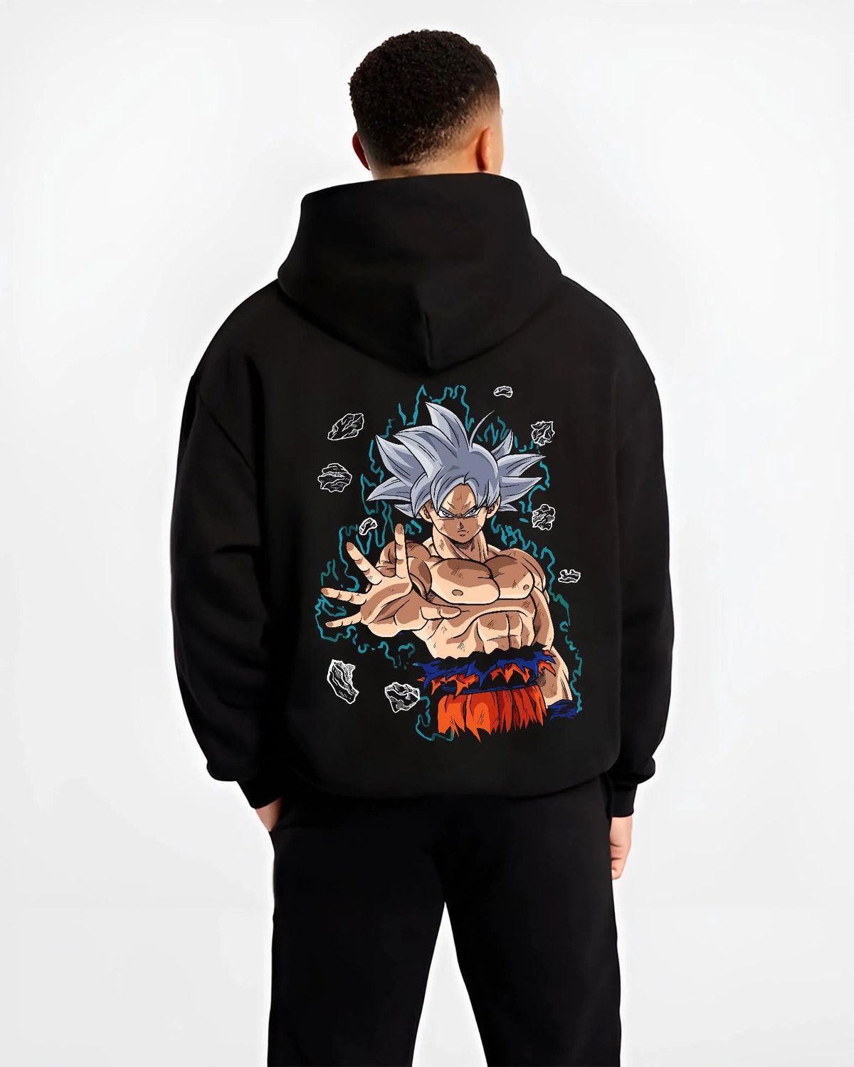 Black hoodie worn by male model from the back featuring Goku Ultra Instinct silver aura artwork.