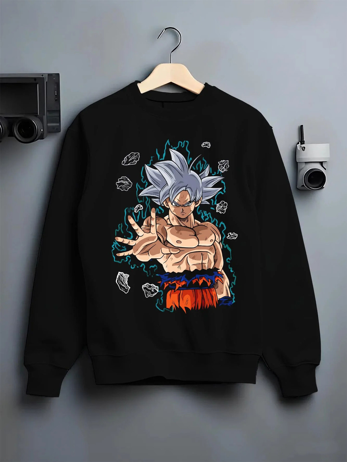 Black crewneck sweatshirt on hanger featuring Goku Ultra Instinct silver aura artwork.