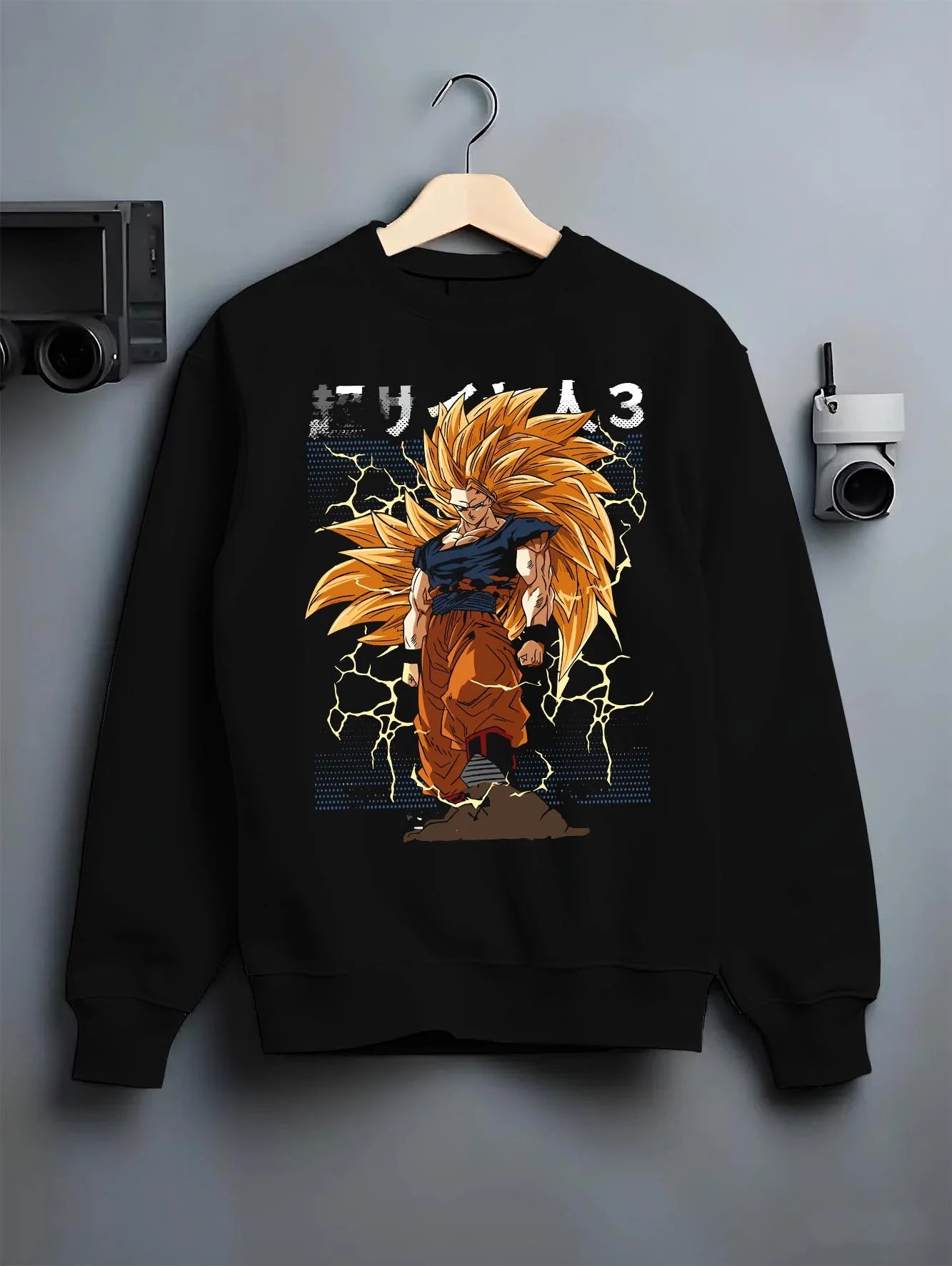 Black crewneck sweatshirt on hanger with Dragon Ball Z Hoodie Goku Super Saiyan 3 Jumper graphic Goku anime design.