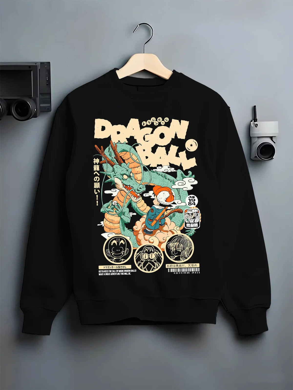 Black crewneck sweatshirt on hanger with Young Son Goku riding Shenron from Dragon Ball illustrated back graphic