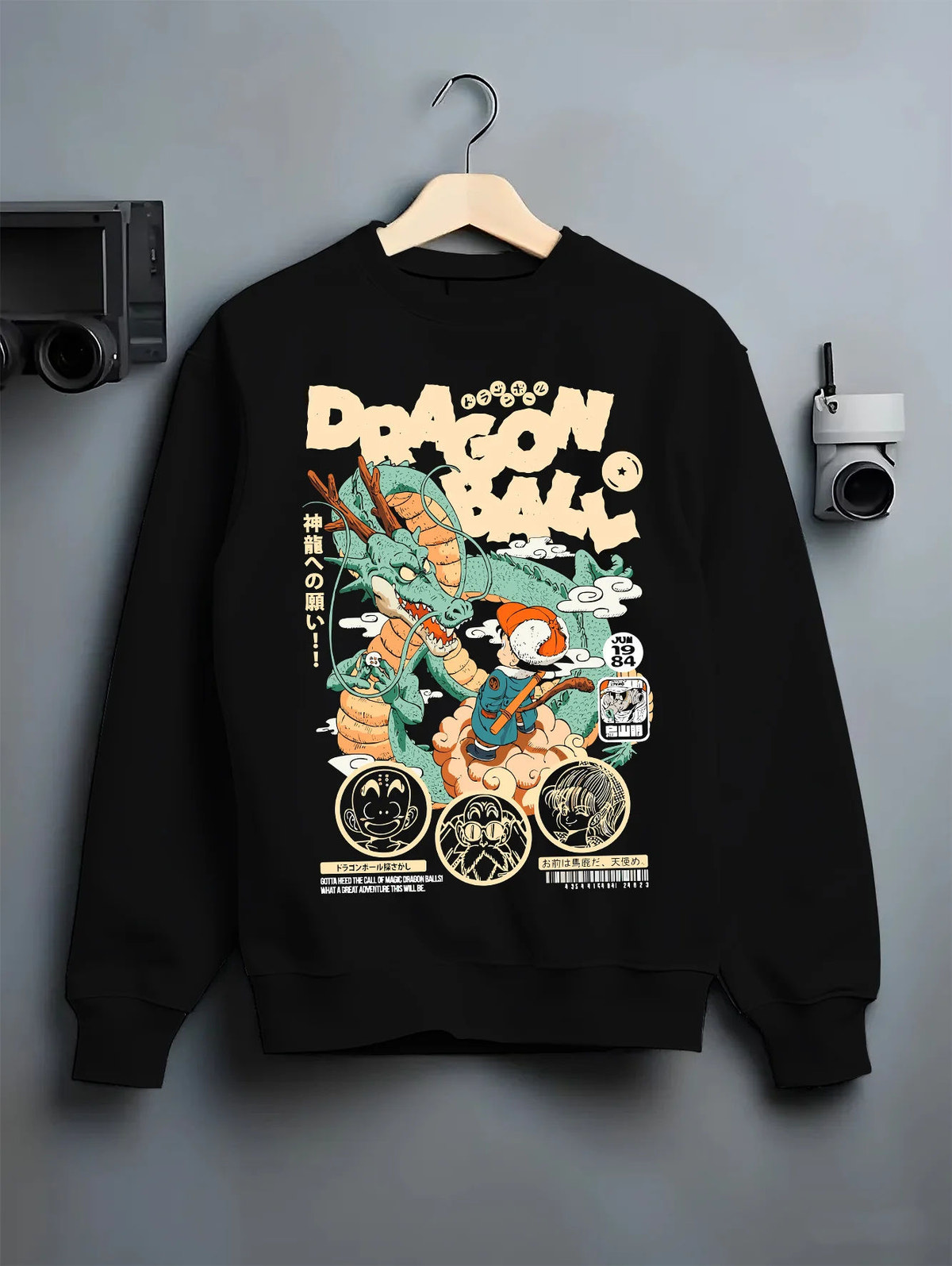 Black crewneck sweatshirt on hanger with Young Son Goku riding Shenron from Dragon Ball illustrated back graphic