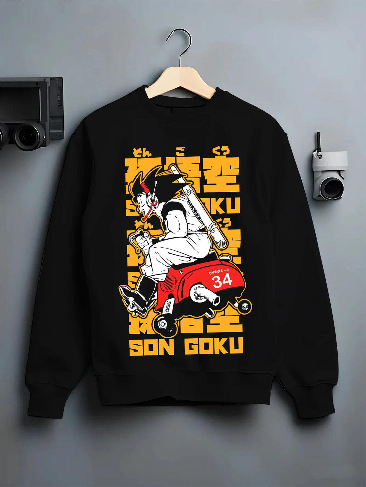 Black crewneck sweatshirt on hanger showing Son Goku from Dragon Ball: motorcycle with 34 racing number