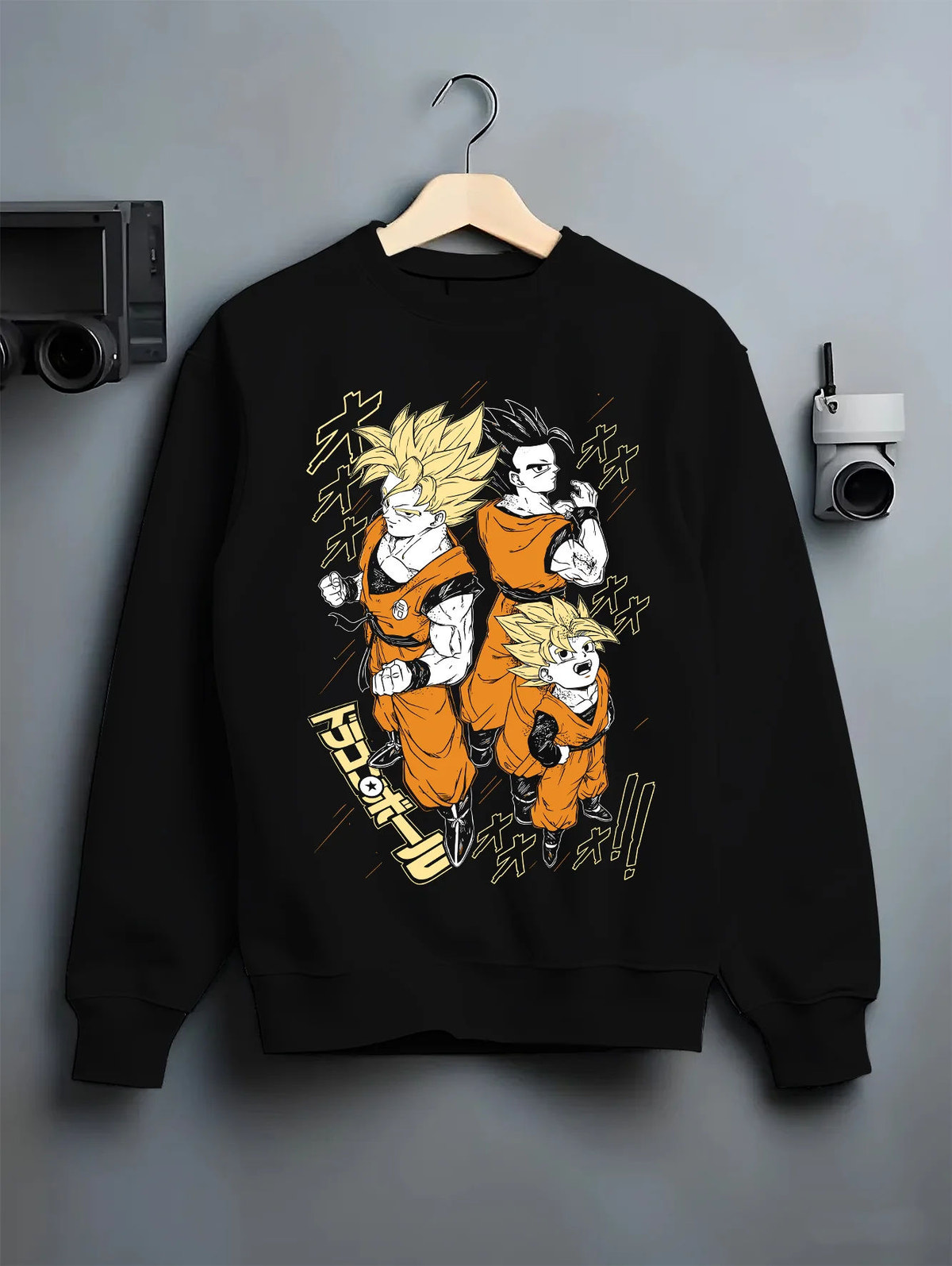 Black crewneck sweatshirt on hanger showing Son Goku and Gohan from Dragon Ball: three-form illustration