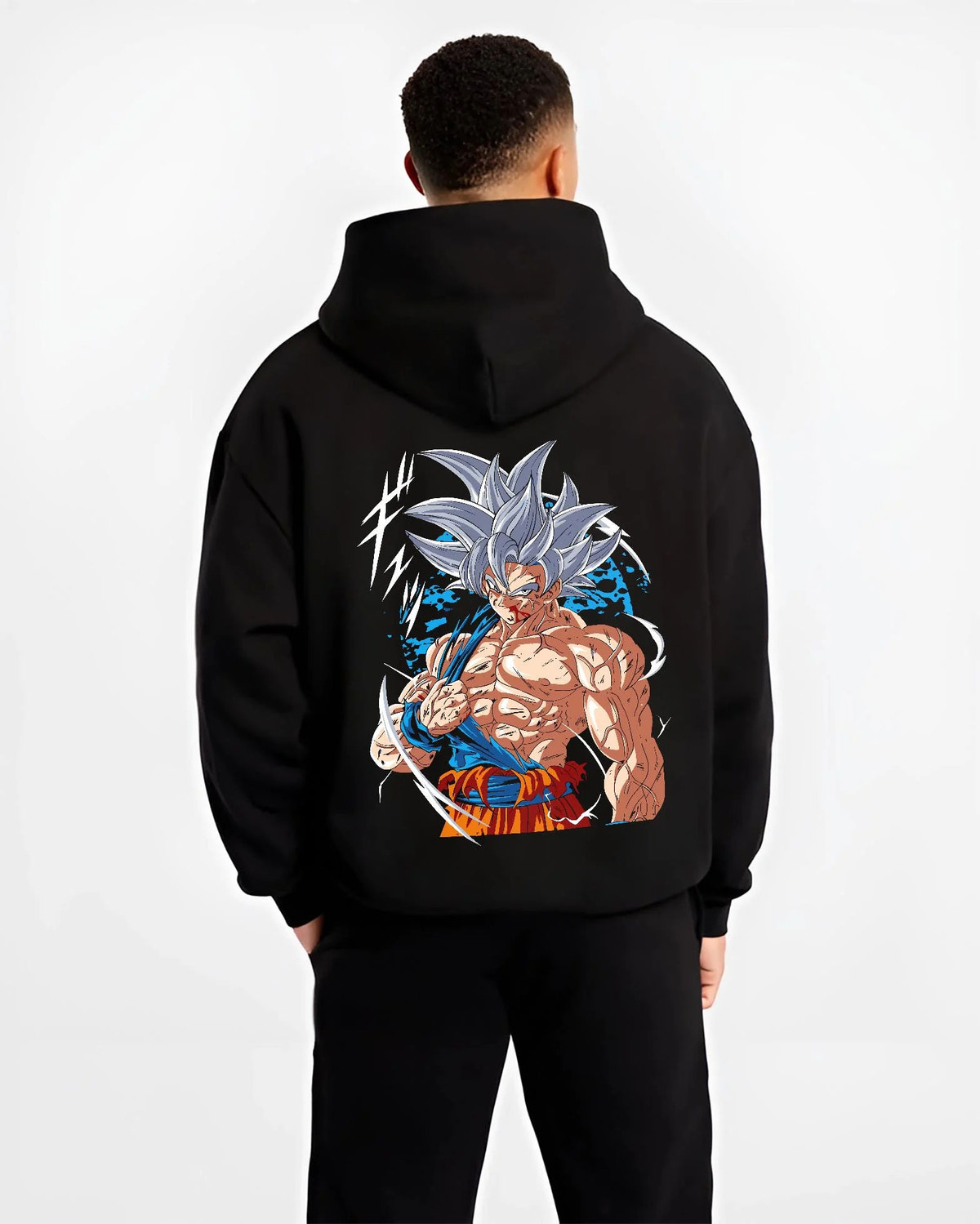 Black hoodie worn by male model from the back featuring Goku mastered Ultra Instinct artwork.