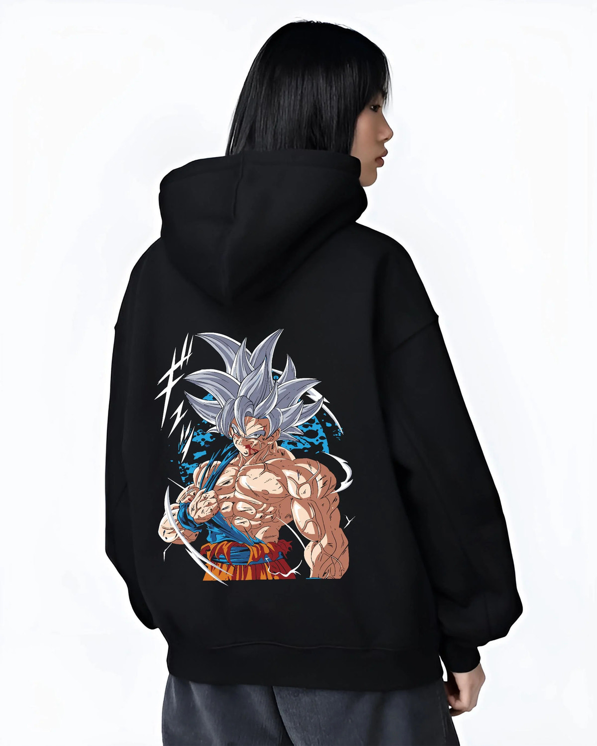 Black hoodie worn by female model from the back featuring Goku mastered Ultra Instinct artwork.