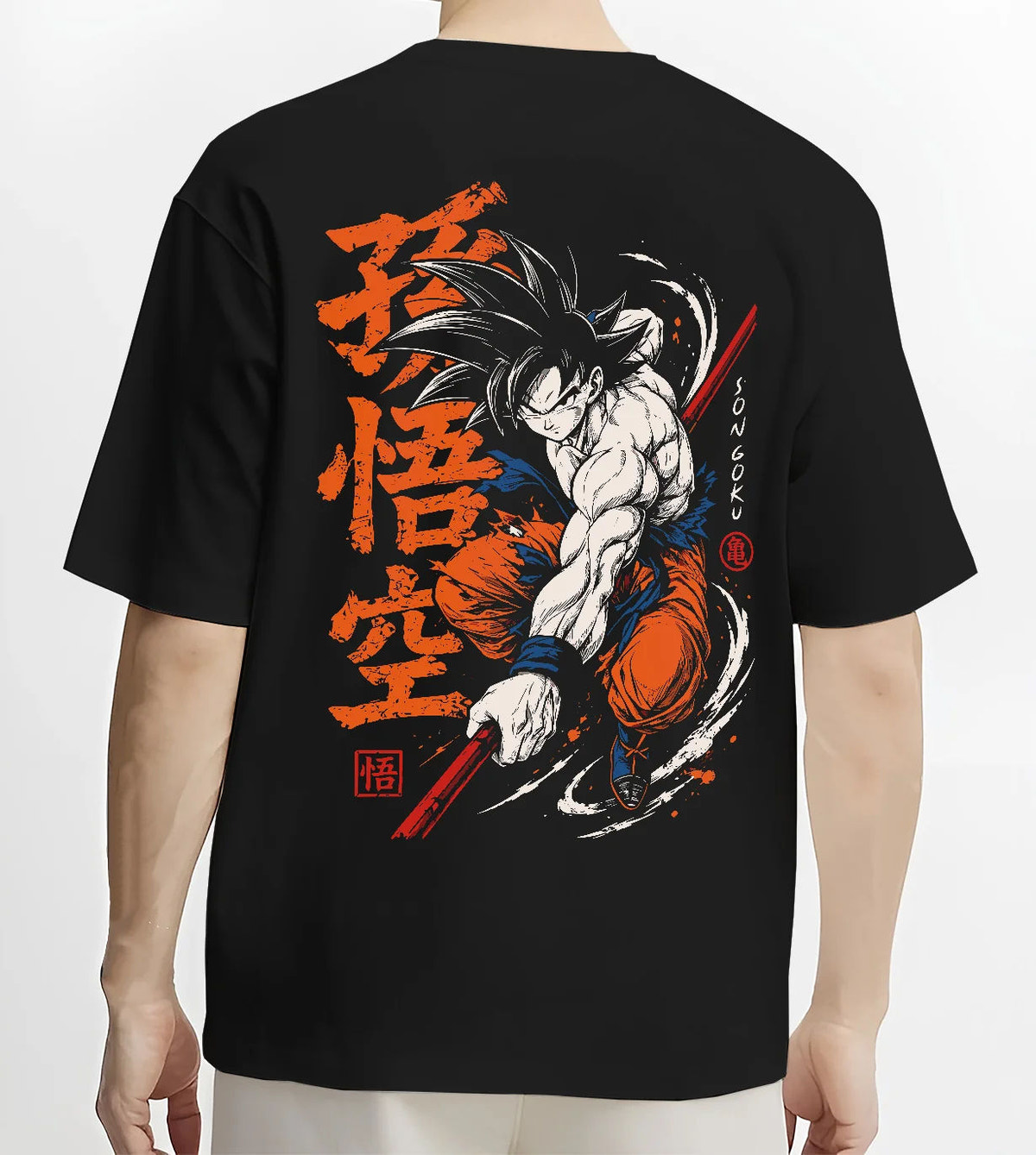 Black T-shirt model back view showing Son Goku from Dragon Ball: dynamic martial arts strike