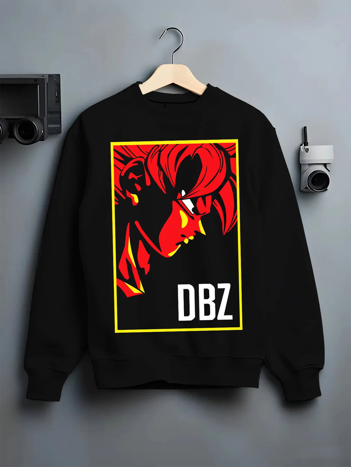 Black crewneck sweatshirt on hanger showing Dragon Ball Z: red silhouette character poster