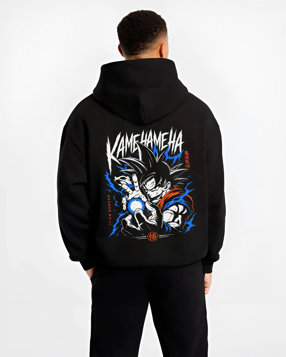 Black hoodie model back view showing Goku from Dragon Ball: Kamehameha energy attack (black-haired)
