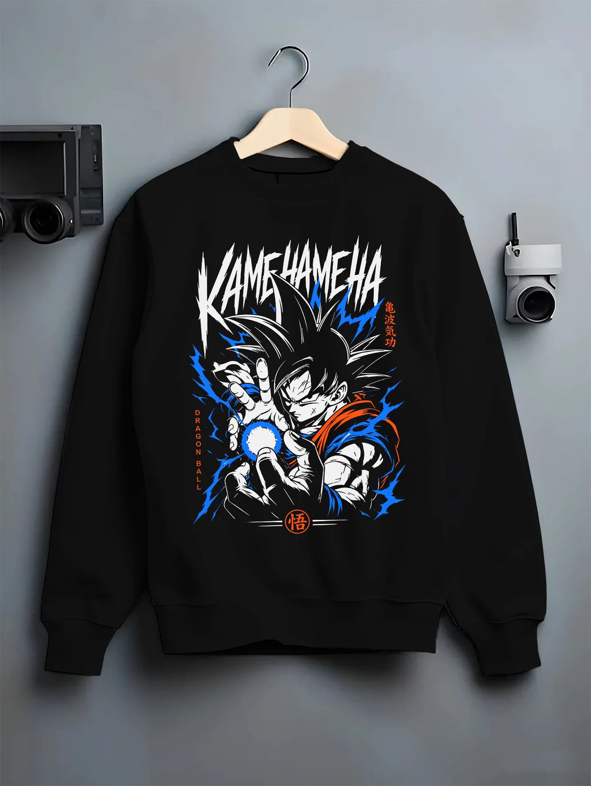 Black crewneck sweatshirt on hanger showing Goku from Dragon Ball: Kamehameha energy attack (black-haired)