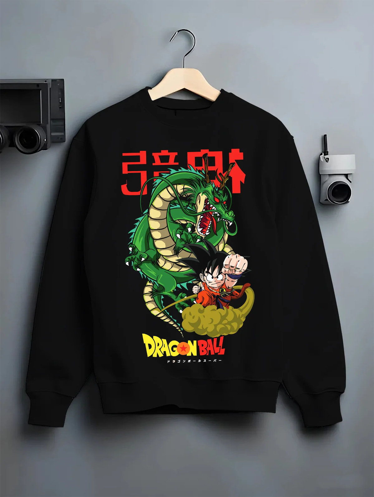 Black crewneck sweatshirt on hanger with Kid Goku with Shenron from Dragon Ball illustrated back graphic