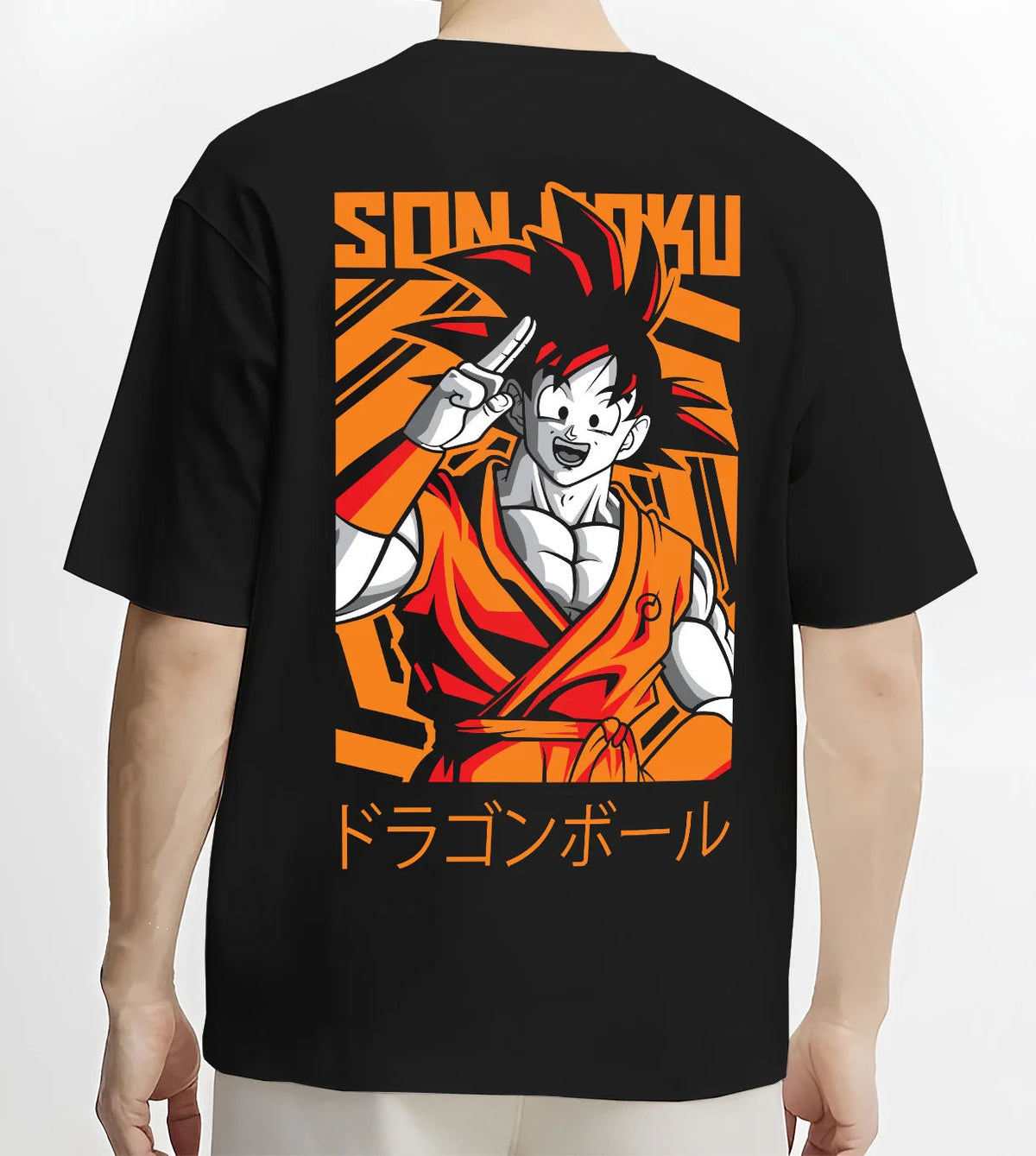 Black T-shirt model back view showing Young Goku from Dragon Ball: orange gi and raised hand