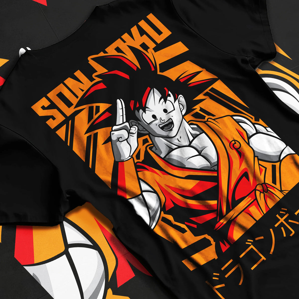 Black T-shirt flat back view showing Young Goku from Dragon Ball: orange gi and raised hand