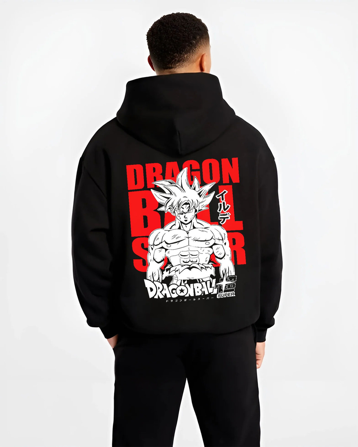 Black hoodie model back view showing Goku from Dragon Ball Super: Ultra Instinct silver-haired portrait