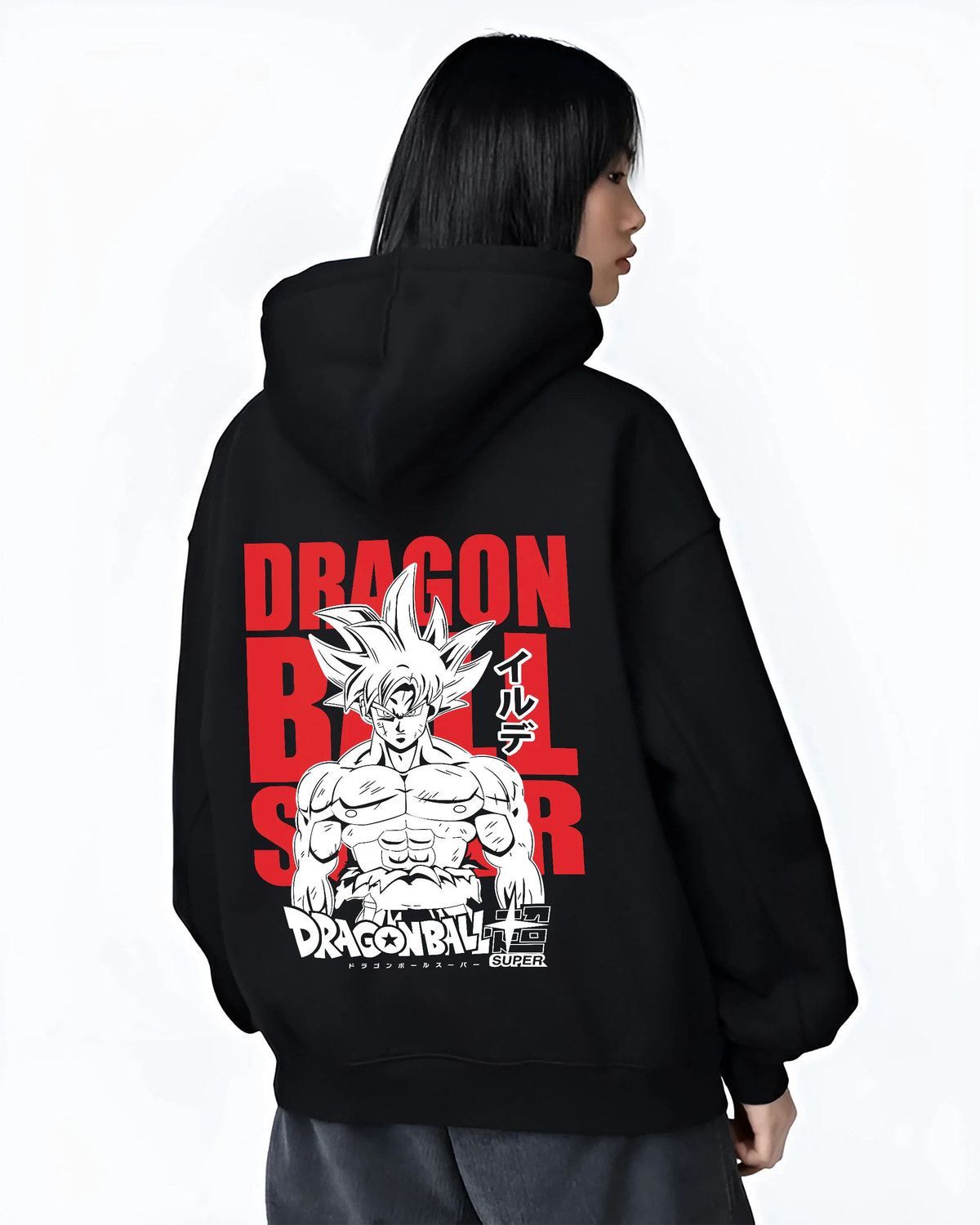 Black hoodie female model back view showing Goku from Dragon Ball Super: Ultra Instinct silver-haired portrait