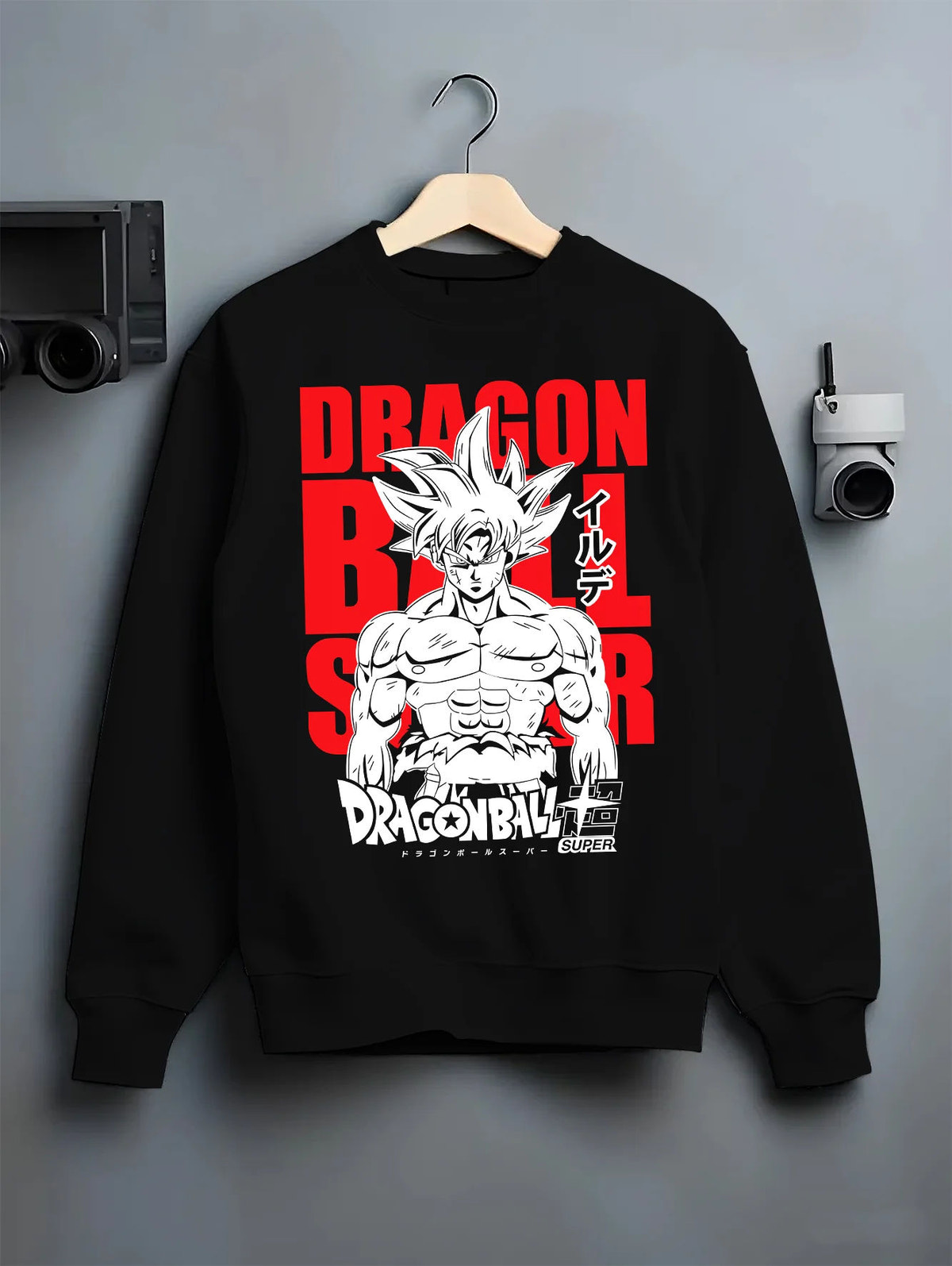 Black crewneck sweatshirt on hanger showing Goku from Dragon Ball Super: Ultra Instinct silver-haired portrait