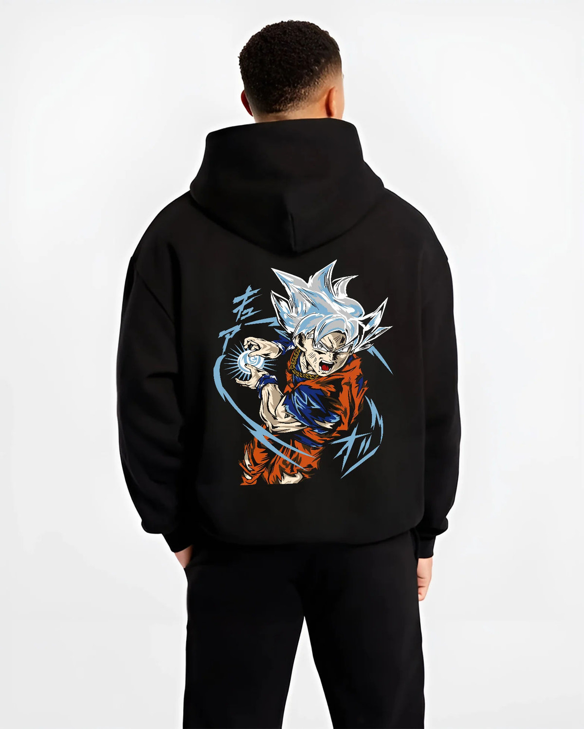 Black hoodie model back view showing Goku from Dragon Ball Super: Ultra Instinct energy charge