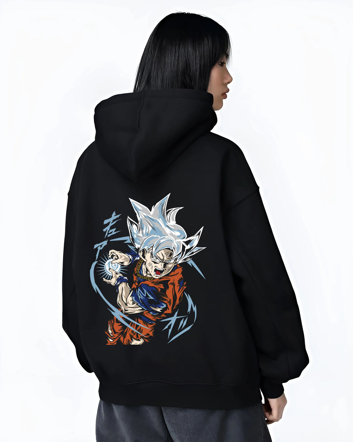 Black hoodie female model back view showing Goku from Dragon Ball Super: Ultra Instinct energy charge