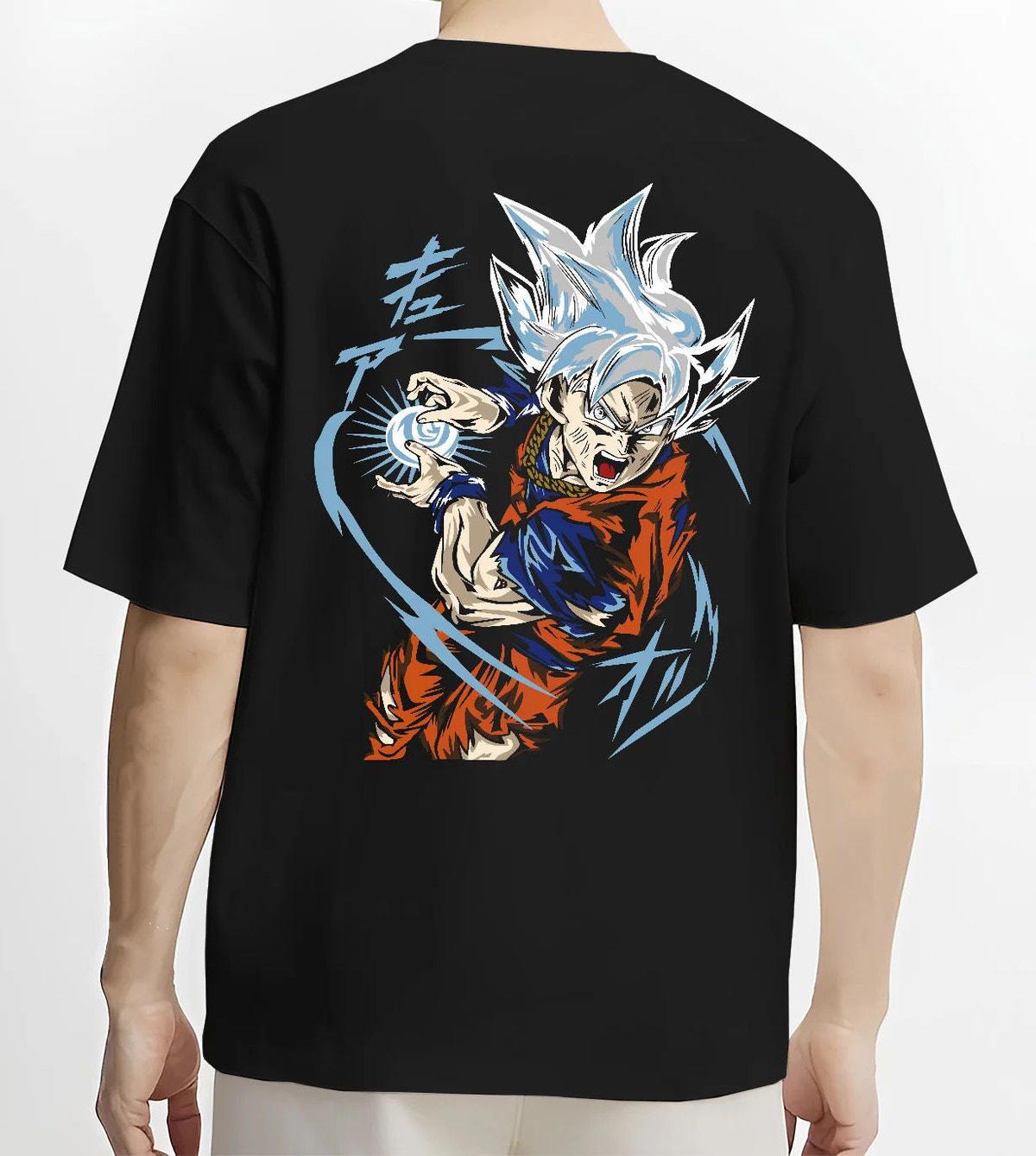 Black T-shirt model back view showing Goku from Dragon Ball Super: Ultra Instinct energy charge