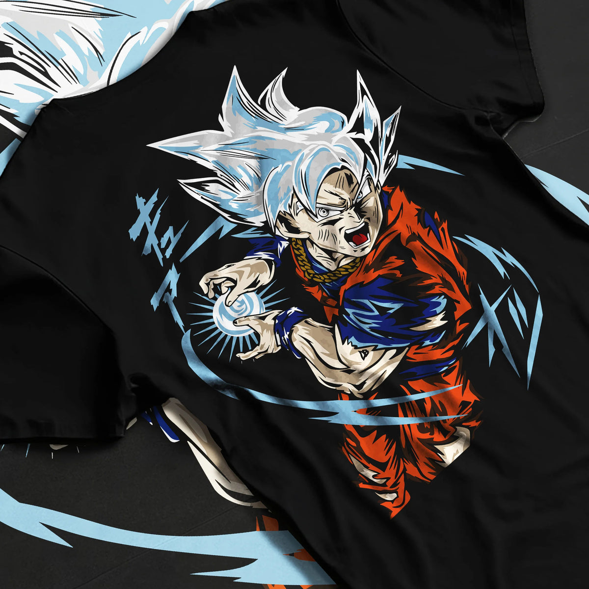 Black T-shirt flat back view showing Goku from Dragon Ball Super: Ultra Instinct energy charge
