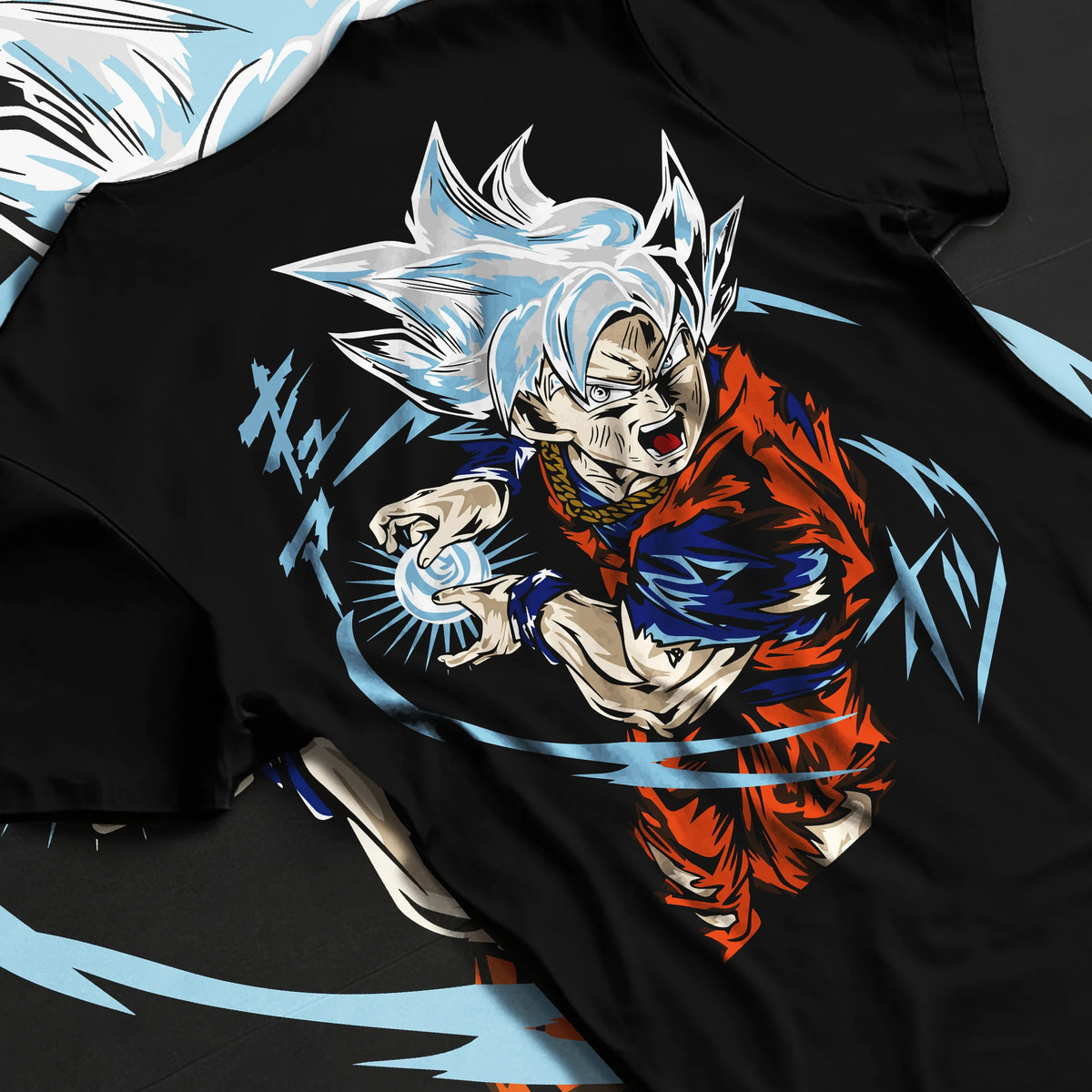 Black T-shirt flat back view showing Goku from Dragon Ball Super: Ultra Instinct energy charge