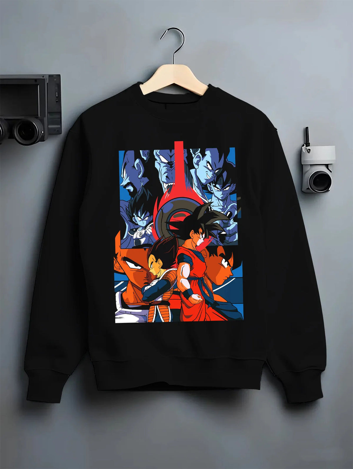 Black crewneck sweatshirt on hanger showing Goku and Vegeta from Dragon Ball: opposing Saiyan fighters