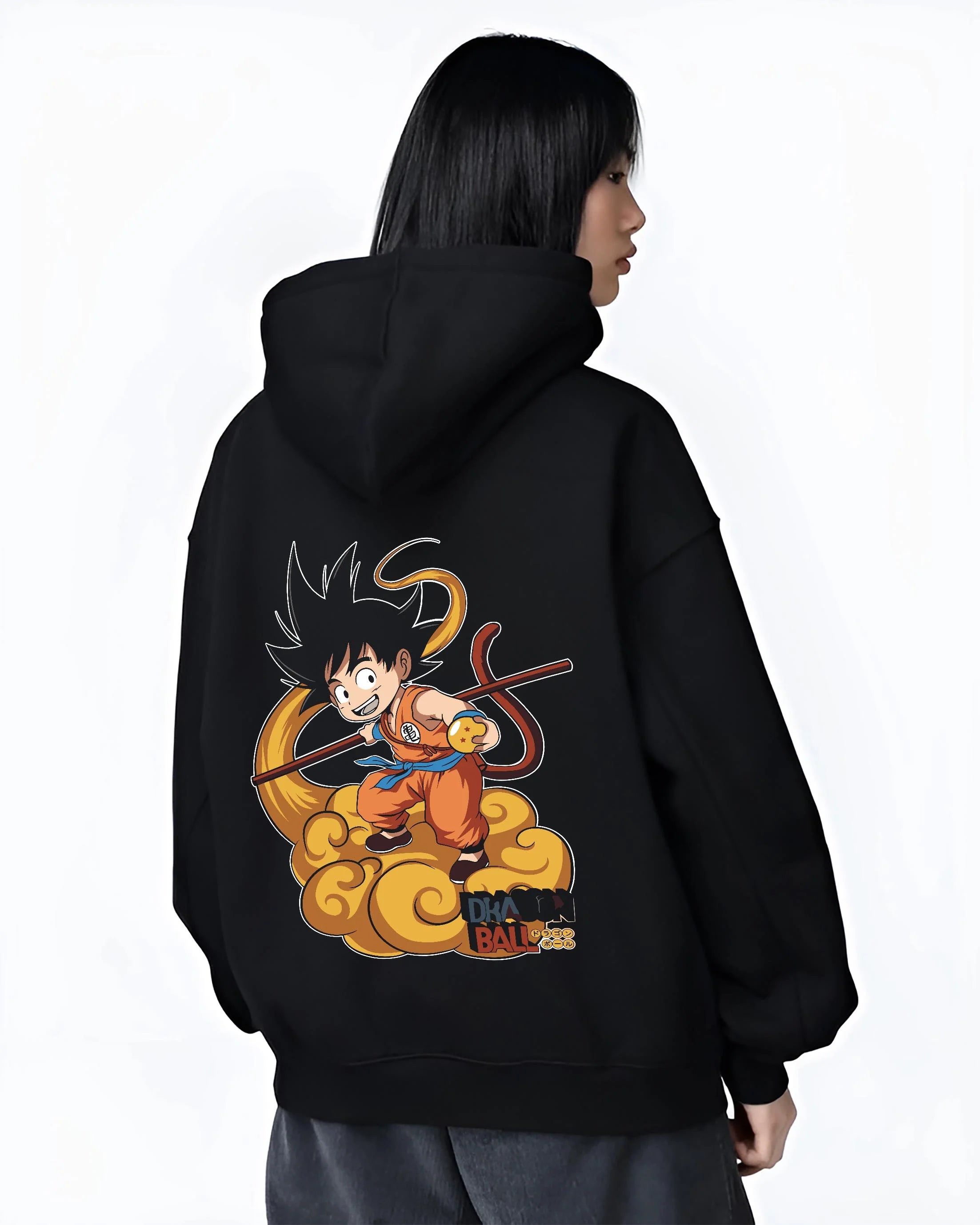 Black hoodie worn by female model, back view with Dragon Ball Z Hoodie Kid Goku Nimbus Jumper graphic streetwear graphic.