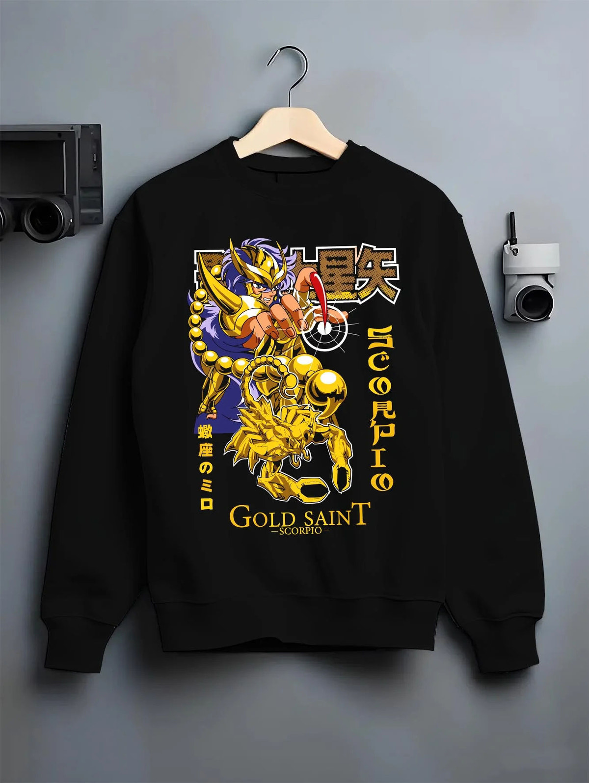 Black crewneck sweatshirt on hanger featuring Scorpio Milo Gold Saint cosmic armour artwork.