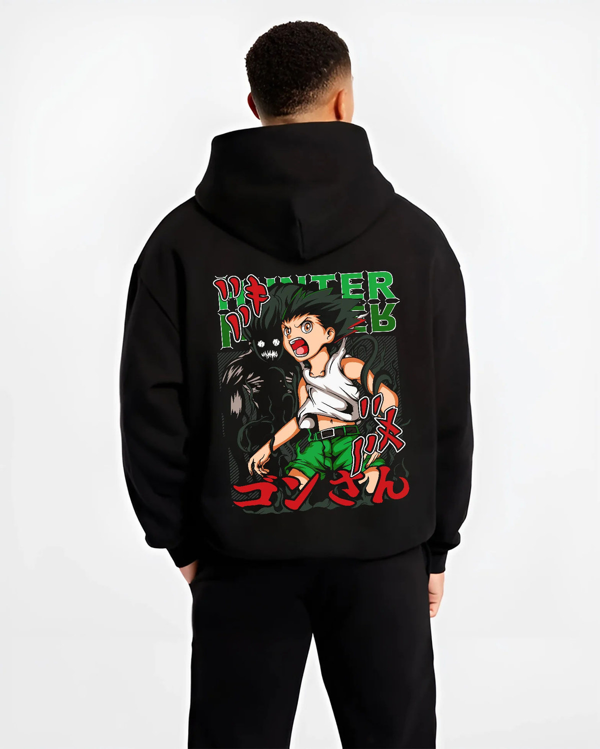 Black hoodie model back view showing Gon Freecss from Hunter x Hunter: youthful action pose