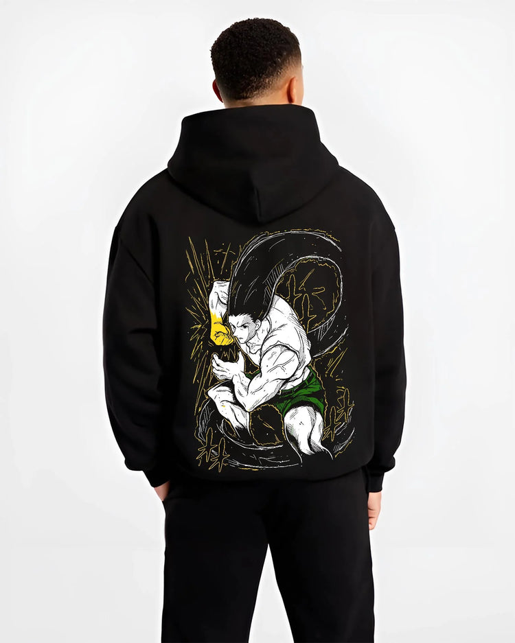 Black hoodie worn by male model, back view with Hunter x Hunter Hoodie Gon Freecss Determined Jumper graphic bold anime graphic.