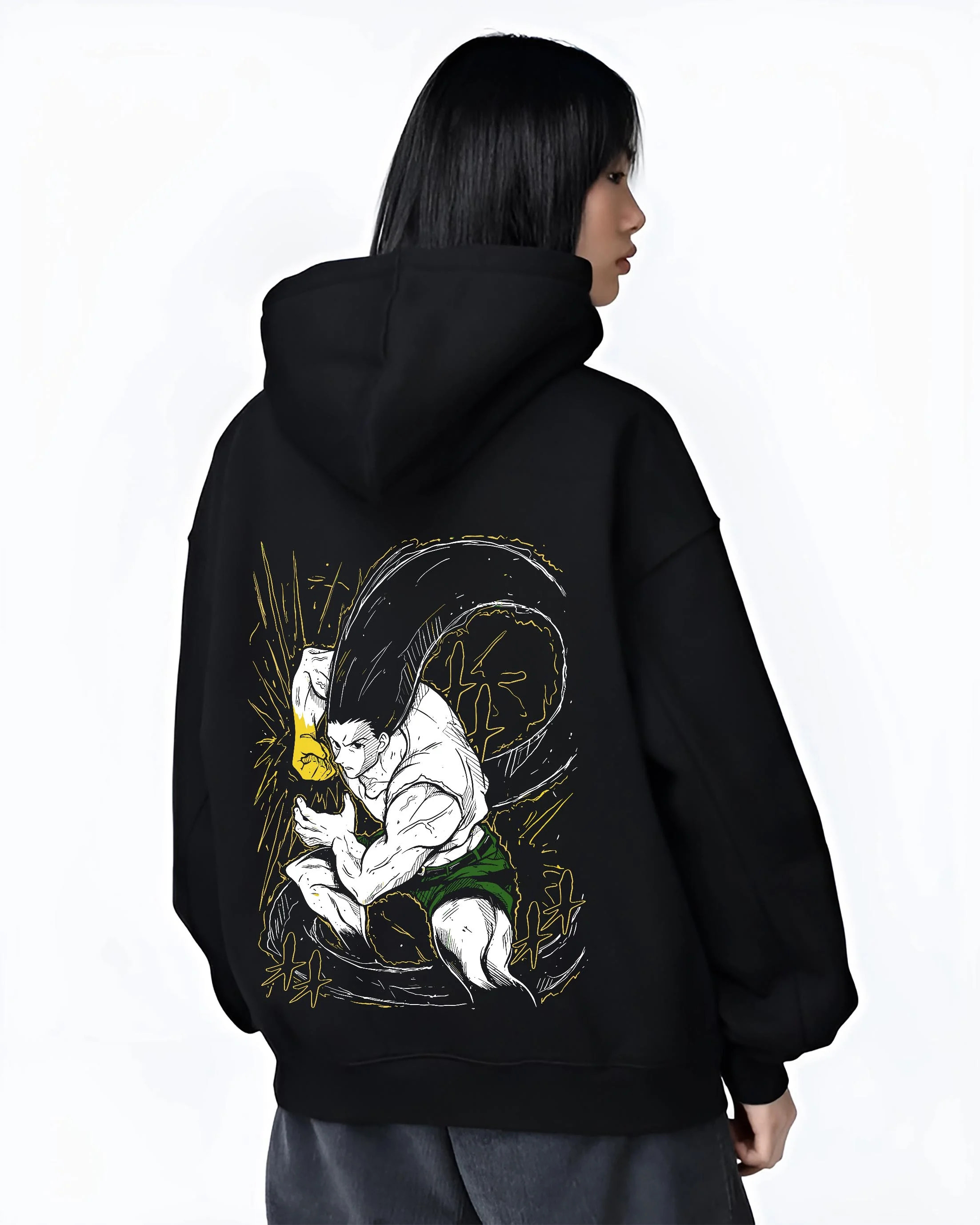 Black hoodie worn by female model, back view with Hunter x Hunter Hoodie Gon Freecss Determined Jumper graphic bold anime graphic.