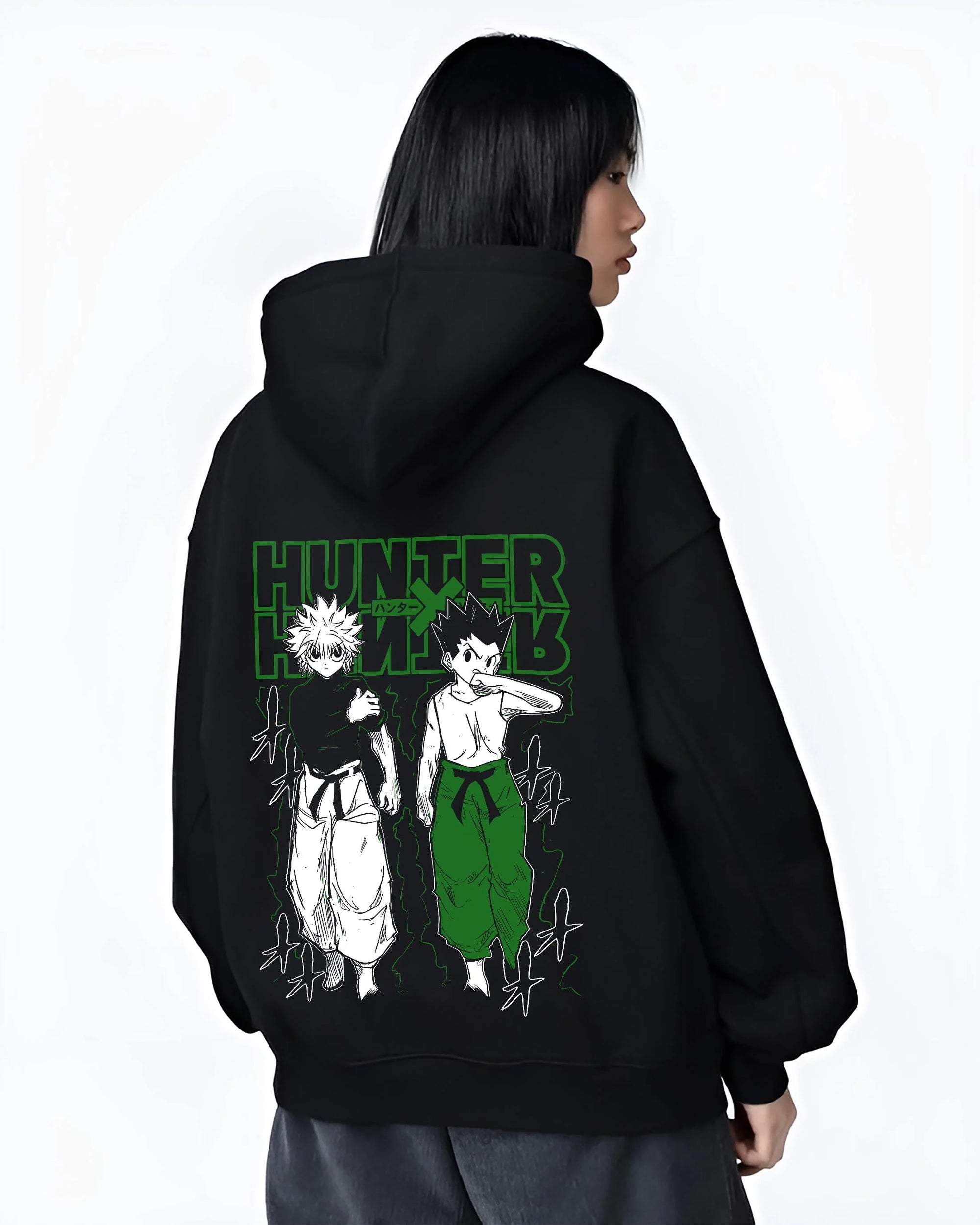 Black hoodie worn by female model, back view with Hunter x Hunter Hoodie Gon Killua Logo Jumper graphic bold anime graphic.