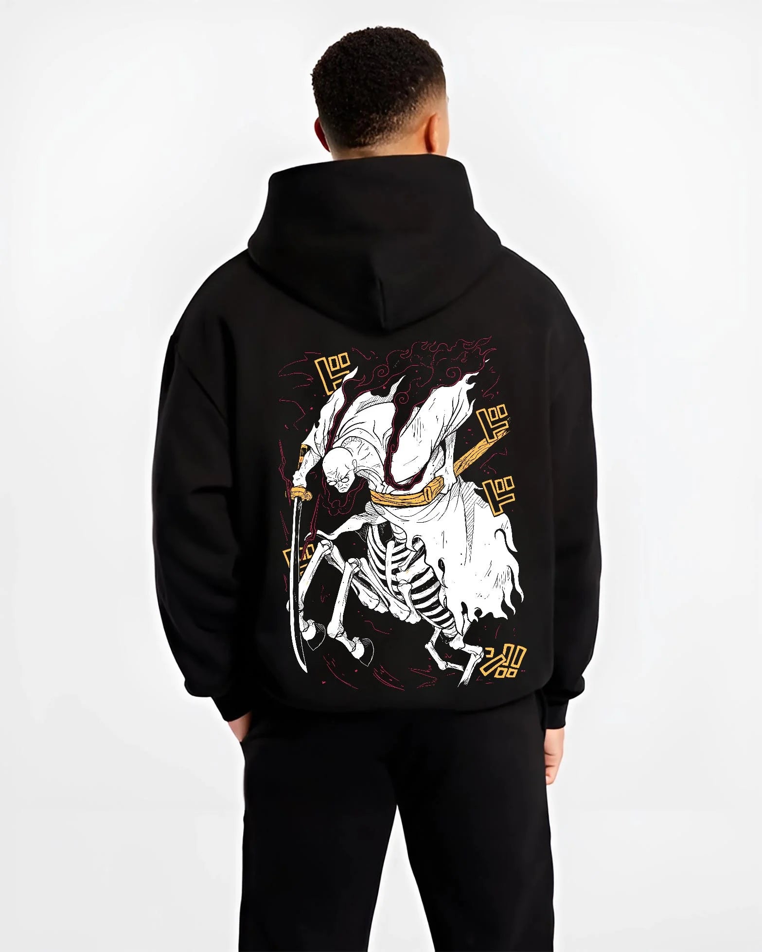 Black hoodie worn by male model, back view with One Piece Hoodie Brook Soul King Rising Jumper graphic bold anime graphic.